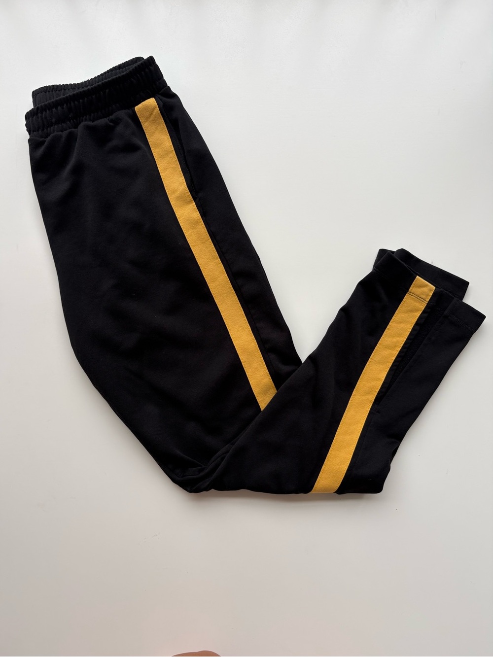 Zara black track pants w/yellow stripe and slits in bottom of pants. WomensSizeM